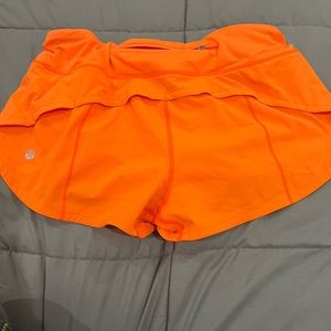 Neon orange Lulu Lemon hotty hot shorts 2.5 inch in size 4